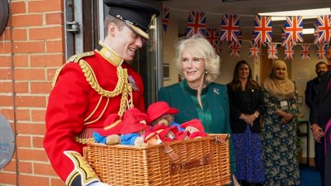 Camilla personally delivered some of the thousands of Paddington Bears left in the Queen's memory.