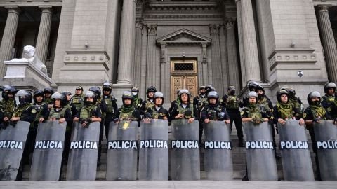 Police guard the Justice Palace in Lima, on December 15, 2022, during a nationwide state of emergency.