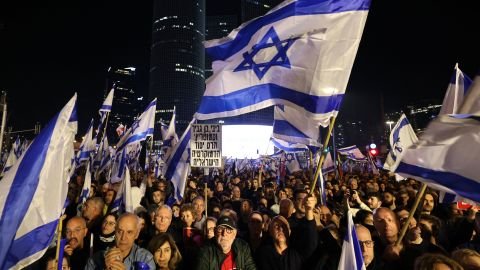 Israeli protesters attend a rally against  Netanyahu's new  government in Tel Aviv on January 21, 2023.