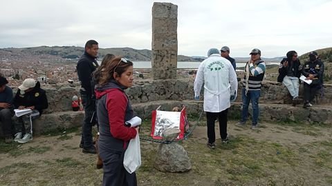 Authorities inspect the mummified body.