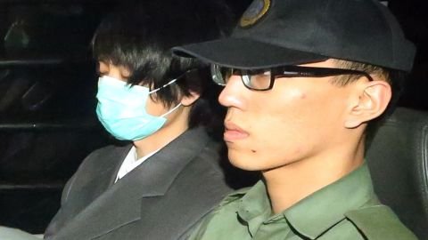 Henry Chau Hoi-leung, who murdered and dismembered his parents, escorted from Hong Kong's High Court on March 20, 2015.