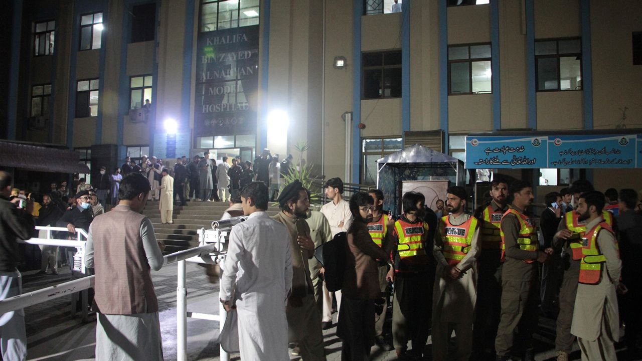 Rescue workers and people gather at a hospital, where earthquake victims are brought, in Saidu Sharif, in Pakistan's Swat Valley on March 21.