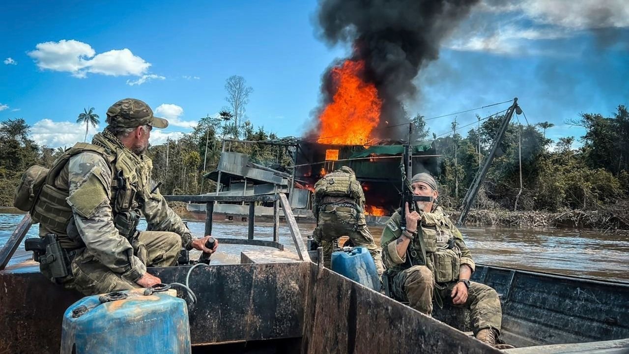 In this image provided by Brazil's Environmental Agency, federal agents destroy an illegal mining barge inside Yanomami Indigenous territory, Roraima state, Brazil, Tuesday, March 14, 2023.