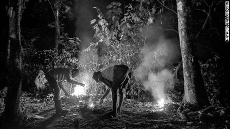 Stopping to camp overnight, people burn plastic to cook what they&#39;ve carried with them. Many have fled countries where food and other basic goods are in short supply.