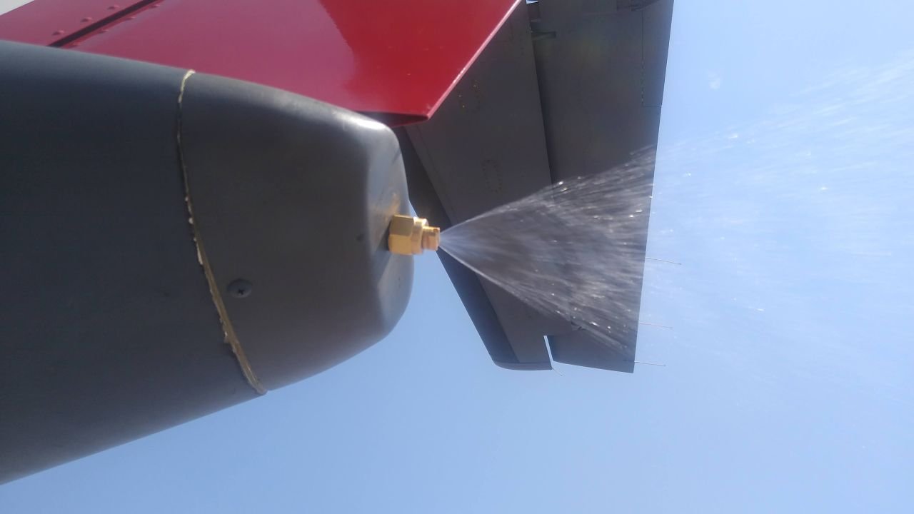 A plane sprays silver iodide particles.