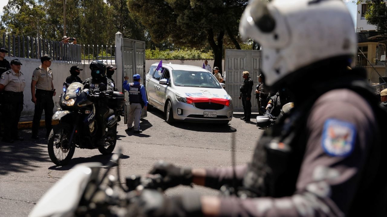 A a car transports the body of Ecuadorean presidential candidate Fernando Villavicencio on August 10.