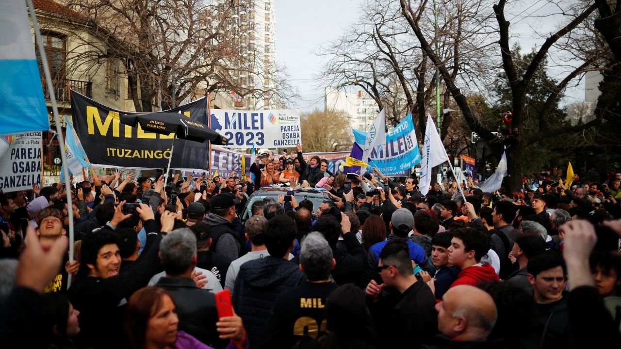 Argentine presidential candidate Javier Milei for La Libertad Avanza coalition gestures next to Carolina Piparo, candidate for Governor of the Province of Buenos Aires, during a campaign rally in La Plata, Buenos Aires on September 12.